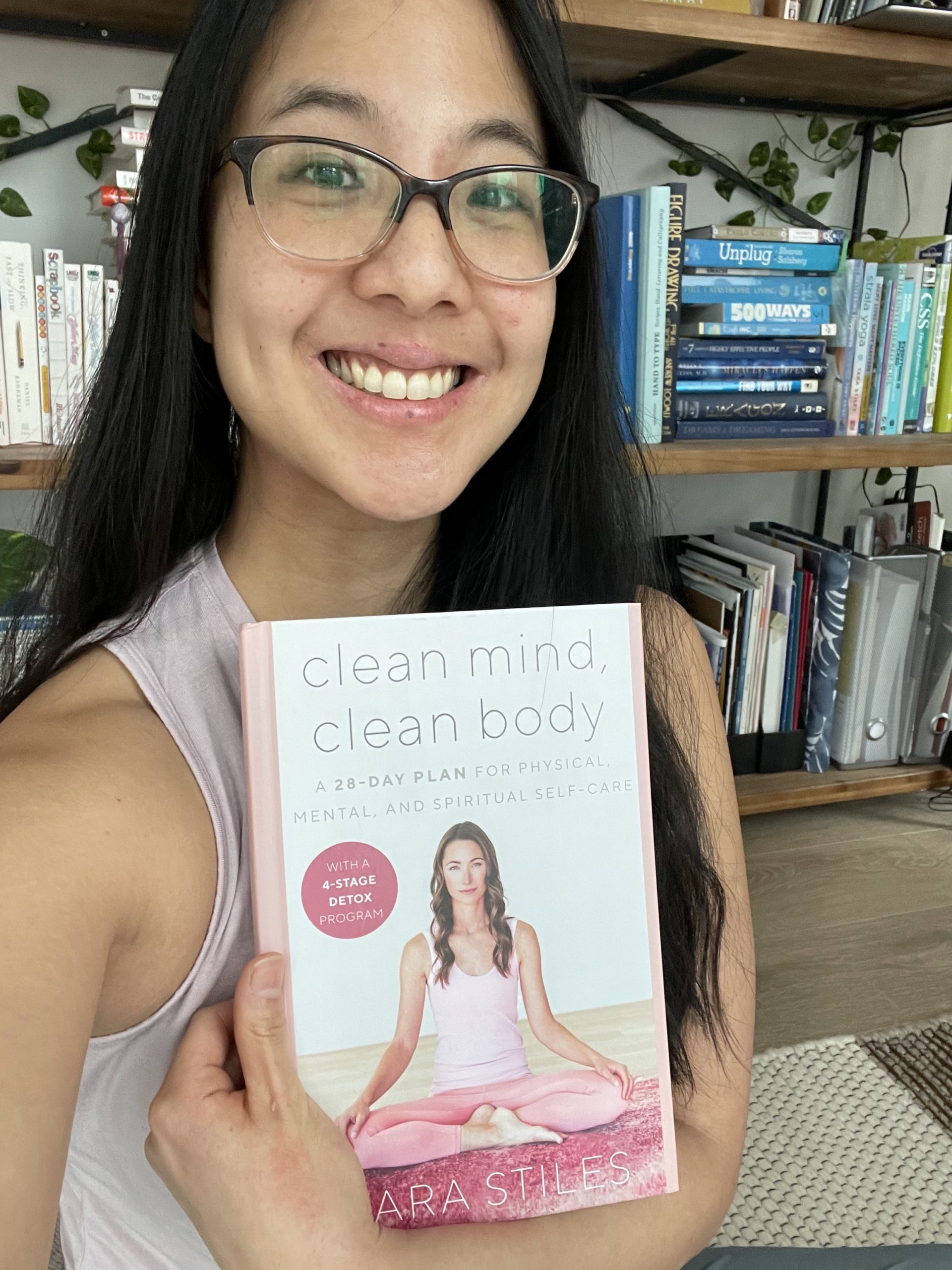 Jessica Lock holding the book Clean Mind Clean Body, talks about slowing down